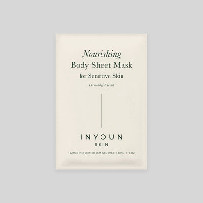 Front view of body sheet mask packet reading Nourishing Body Sheet Mask for Sensitive Skin on light gray background